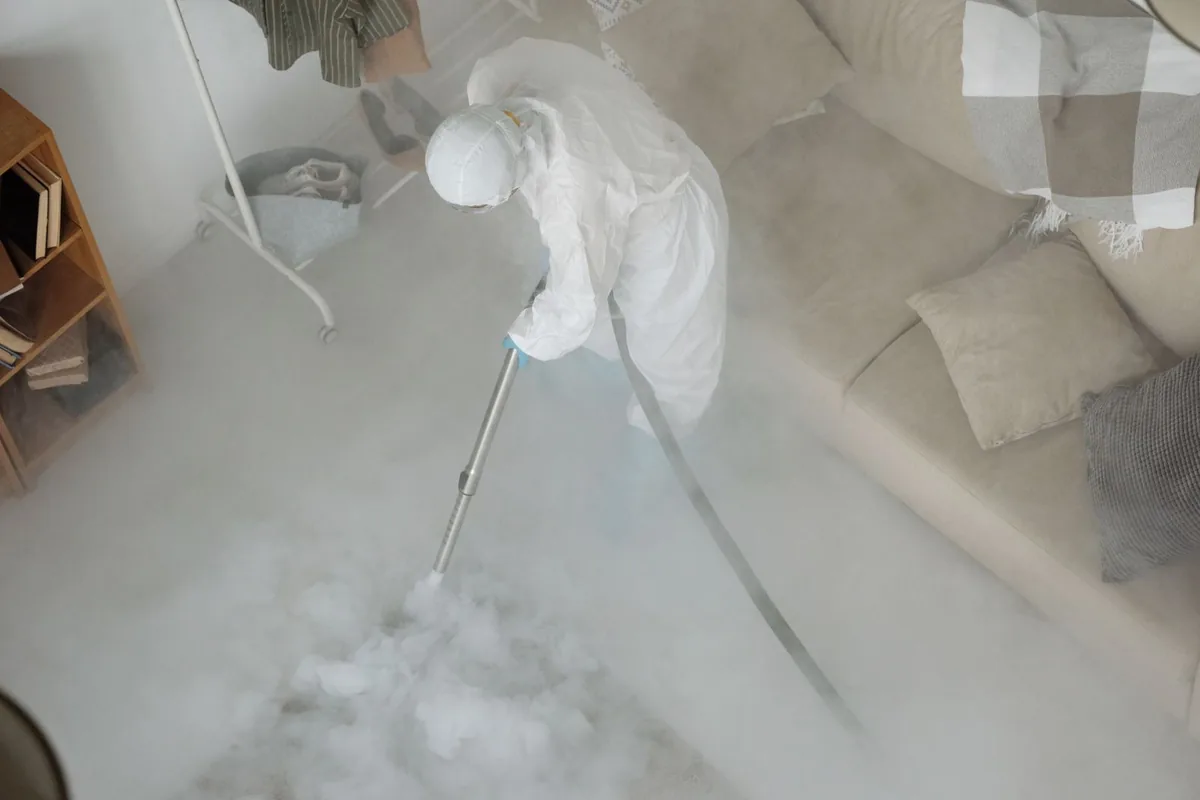 Biohazard cleanup technician in protective equipment, Fargo, ND